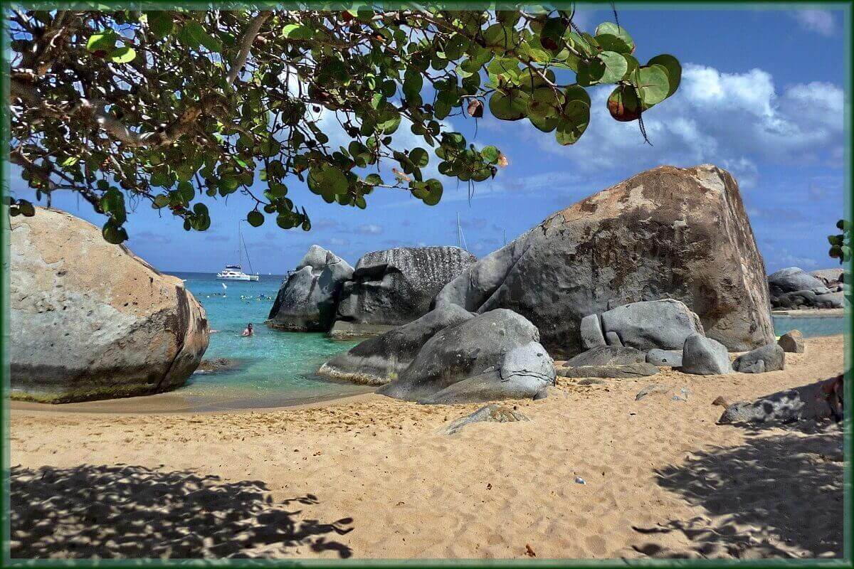 Sandy beach with boulders in the British Virgin Islands.